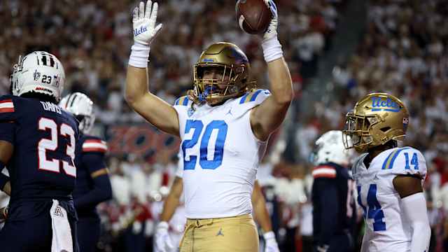 Nov 4, 2023; Tucson, Arizona, USA; UCLA Bruins running back Carsen Ryan #20 celebrates a touchdown against the Arizona Wildcats during the first half at Arizona Stadium. Mandatory Credit: Zachary BonDurant-USA TODAY Sports